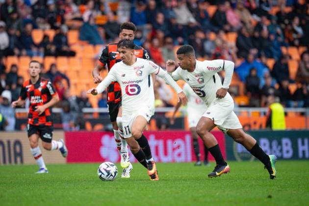 FOOTBALL : Lorient vs Lille - Ligue 1 - 30 08 2025 Osame Sahraoui ( 11 - Lille ) and Montassar TALBI ( 3 - FC Lorient ) during the Ligue 1 match between FC Lorient and Lille OSC at Stade Yves Allainmat on August 30, 2025 in Lorient, France. ( Photo by Federico Pestellini PsnewZ ) - LorientFrance  Copyright: xFedericoxPestellinix