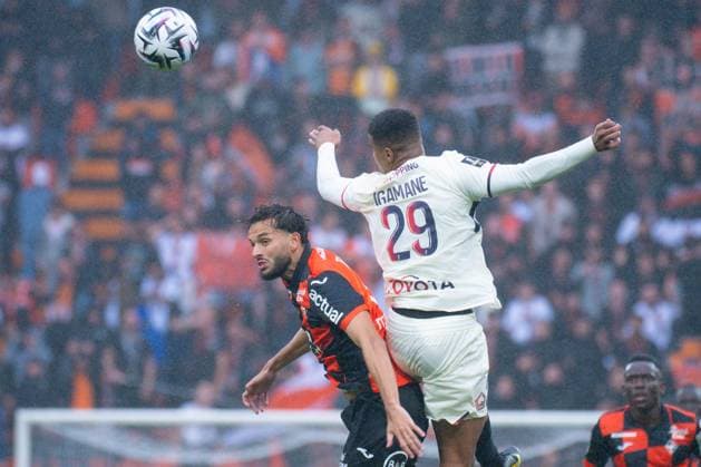 FOOTBALL : Lorient vs Lille - Ligue 1 - 30 08 2025 Hamza Igmane ( 29 - Lille ) and Montassar TALBI ( 3 - FC Lorient ) during the Ligue 1 match between FC Lorient and Lille OSC at Stade Yves Allainmat on August 30, 2025 in Lorient, France. ( Photo by Federico Pestellini PsnewZ ) - LorientFrance  Copyright: xFedericoxPestellinix