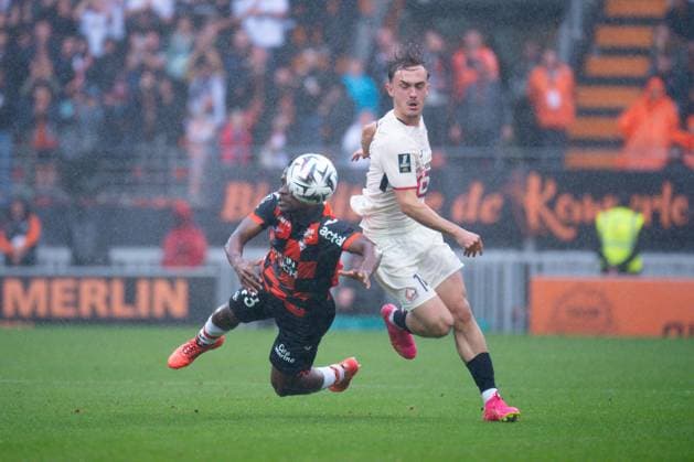 FOOTBALL : Lorient vs Lille - Ligue 1 - 30 08 2025 Arsene Kouassi ( 43 - Lorient ) and Marius Broholm ( 14 - Lille ) during the Ligue 1 match between FC Lorient and Lille OSC at Stade Yves Allainmat on August 30, 2025 in Lorient, France. ( Photo by Federico Pestellini PsnewZ ) - LorientFrance  Copyright: xFedericoxPestellinix