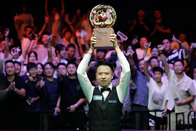 WUHAN, CHINA - AUGUST 30: Xiao Guodong of China poses with champion trophy after winning the Final match against Gary Wilson of England on day 7 of the 2025 Wuhan Open at Optics Valley Gymnasium of HUST on August 30, 2025 in Wuhan, Hubei Province of China.  Copyright: xTaixChengzhex 111587868013
