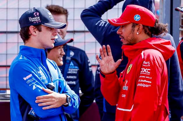 Drivers Parade Franco Colapinto of Argentina and BWT Alpine F1 Team and Lewis Hamilton of the United Kingdom and Scuderia Ferrari HP F1 Team looks on during the Formula 1 Heineken Dutch Grand Prix 2025 on Day 3 at Circuit Zandvoort on August 31, 2025 in Zandvoort, Netherlands. (Photo by Marcel ter Bals DeFodi Images)