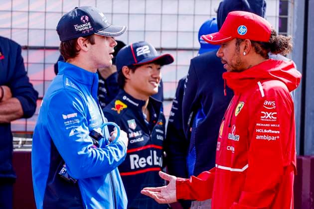 Drivers Parade Franco Colapinto of Argentina and BWT Alpine F1 Team and Lewis Hamilton of the United Kingdom and Scuderia Ferrari HP F1 Team looks on during the Formula 1 Heineken Dutch Grand Prix 2025 on Day 3 at Circuit Zandvoort on August 31, 2025 in Zandvoort, Netherlands. (Photo by Marcel ter Bals DeFodi Images)