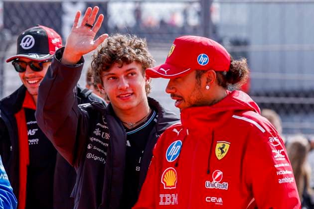 Drivers Parade Andrea Kimi Antonelli of Italy and Mercedes AMG Petronas F1 Team wave and Lewis Hamilton of the United Kingdom and Scuderia Ferrari HP F1 Team looks on during the Formula 1 Heineken Dutch Grand Prix 2025 on Day 3 at Circuit Zandvoort on August 31, 2025 in Zandvoort, Netherlands. (Photo by Marcel ter Bals DeFodi Images)