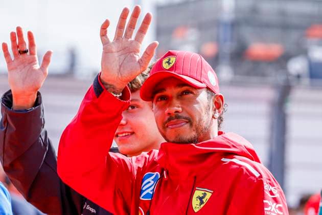 Drivers Parade Andrea Kimi Antonelli of Italy and Mercedes AMG Petronas F1 Team wave and Lewis Hamilton of the United Kingdom and Scuderia Ferrari HP F1 Team looks on during the Formula 1 Heineken Dutch Grand Prix 2025 on Day 3 at Circuit Zandvoort on August 31, 2025 in Zandvoort, Netherlands. (Photo by Marcel ter Bals DeFodi Images)