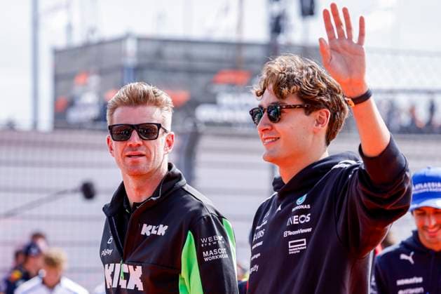 Drivers Parade Nico Hülkenberg of Germany and Stake F1 Team Kick Sauber looks on and George Russell of the United Kingdom and Mercedes AMG Petronas F1 Team wave during the Formula 1 Heineken Dutch Grand Prix 2025 on Day 3 at Circuit Zandvoort on August 31, 2025 in Zandvoort, Netherlands. (Photo by Marcel ter Bals DeFodi Images)