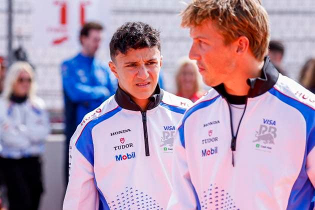Drivers Parade Isack Hadjar of France and Visa Cash App Racing Bulls looks on and Liam Lawson of New Zealand and Visa Cash App Racing Bulls during the Formula 1 Heineken Dutch Grand Prix 2025 on Day 3 at Circuit Zandvoort on August 31, 2025 in Zandvoort, Netherlands. (Photo by Marcel ter Bals DeFodi Images)
