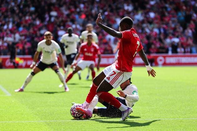Nottingham, England, 31st August 2025. Callum Hudson-Odoi of Nottingham Forest goes down under the challenge from Kyle Walker-Peters of West Ham United but nothing is given during the Nottingham Forest vs West Ham United Premier League match at the City Ground, Nottingham. Picture credit should read: James Baylis Sportimage EDITORIAL USE ONLY. No use with unauthorised audio, video, data, fixture lists, club league logos or live services. Online in-match use limited to 120 images, no video emulation. No use in betting, games or single club league player publications. SPI_027_JB_Forest_WestHam SPI-4100-0027