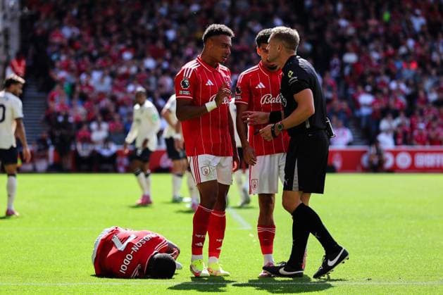 Nottingham, England, 31st August 2025. Dan Ndoye of Nottingham Forest talks to referee Craig Pawson after a challenge from Kyle Walker-Peters of West Ham United brings down Callum Hudson-Odoi of Nottingham Forest during the Nottingham Forest vs West Ham United Premier League match at the City Ground, Nottingham. Picture credit should read: James Baylis Sportimage EDITORIAL USE ONLY. No use with unauthorised audio, video, data, fixture lists, club league logos or live services. Online in-match use limited to 120 images, no video emulation. No use in betting, games or single club league player publications. SPI_029_JB_Forest_WestHam SPI-4100-0029