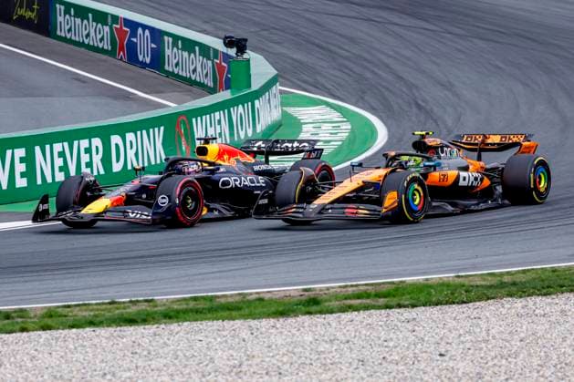 Lando Norris of the United Kingdom and McLaren F1 Team overtakes Max Verstappen of the Netherlands and Oracle Red Bull Racing during the Formula 1 Heineken Dutch Grand Prix 2025 on Day 3 at Circuit Zandvoort on August 31, 2025 in Zandvoort, Netherlands. (Photo by Marcel ter Bals DeFodi Images)