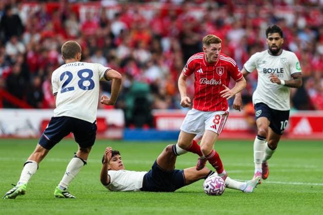 Nottingham, England, 31st August 2025. Elliot Anderson of Nottingham Forest evades a tackle from Mateus Fernandes of West Ham United during the Nottingham Forest vs West Ham United Premier League match at the City Ground, Nottingham. Picture credit should read: James Baylis Sportimage EDITORIAL USE ONLY. No use with unauthorised audio, video, data, fixture lists, club league logos or live services. Online in-match use limited to 120 images, no video emulation. No use in betting, games or single club league player publications. SPI_038_JB_Forest_WestHam SPI-4100-0038