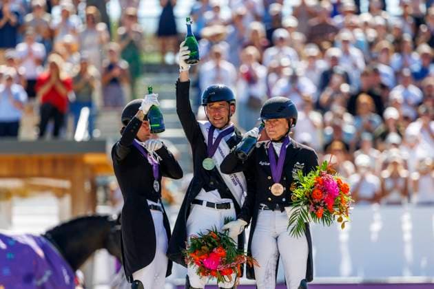 CROZET (FRA) - FEI Dressage European Championship, EM, Europameisterschaft 2025, CROZET (FRA) - FEI Dressage European Championship 2025 VERBOOMEN Justin (BEL), LAUDRUP-DUFOUR Cathrine (DEN), WERTH Isabell (GER) Sektdusche Siegerehrung Prize giving ceremony Freestyle Kür - Individual Competition Crozet, Jiva Hill Stables 31. August 2025 - *** CROZET FRA FEI Dressage European Championship 2025, CROZET FRA FEI Dressage European Championship 2025 VERBOOMEN Justin BEL , LAUDRUP DUFOUR Cathrine DEN , WERTH Isabell GER Champagne shower Prize giving ceremony Freestyle Freestyle Individual Competition Crozet, Jiva Hill Stables August 31, 2025