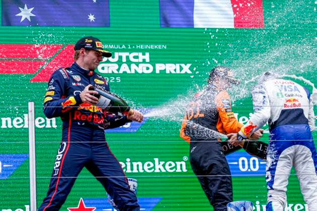 podium ceremony, Max Verstappen of the Netherlands and Oracle Red Bull Racing and Oscar Piastri of Australia and McLaren F1 Team and Isack Hadjar of France and Visa Cash App Racing Bulls spray champge during the Formula 1 Heineken Dutch Grand Prix 2025 on Day 3 at Circuit Zandvoort on August 31, 2025 in Zandvoort, Netherlands. (Photo by Marcel ter Bals DeFodi Images)