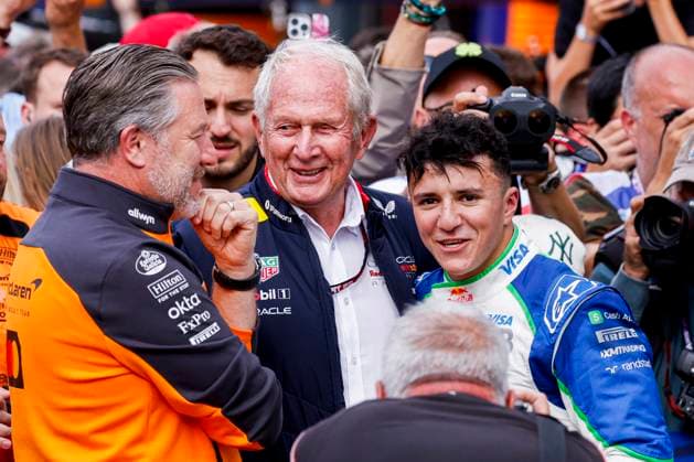 P3 finisher Isack Hadjar of France and Visa Cash App Racing Bulls is congratulated by Helmut Marko of Oracle Red Bull Racing and CEO of McLaren F1 Team Zak Brown during the Formula 1 Heineken Dutch Grand Prix 2025 on Day 3 at Circuit Zandvoort on August 31, 2025 in Zandvoort, Netherlands. (Photo by Marcel ter Bals DeFodi Images)