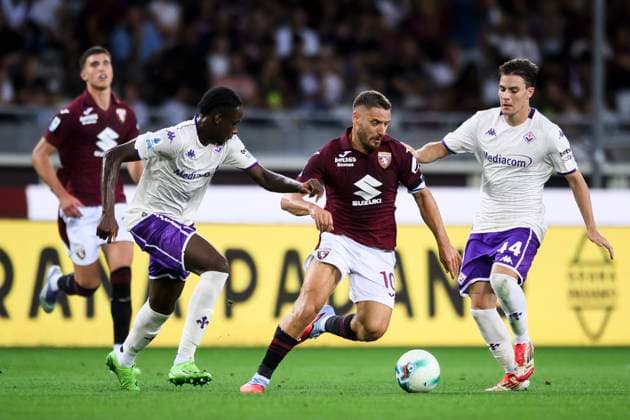 Torino FC v ACF Fiorentina - Serie A Nikola Vlasic of Torino FC competes for the ball with Eddy Kouadio of ACF Fiorentina and Nicolo Fagioli of ACF Fiorentina during the Serie A football match between Torino FC and ACF Fiorentina. Turin Italy Copyright: xNicolòxCampox