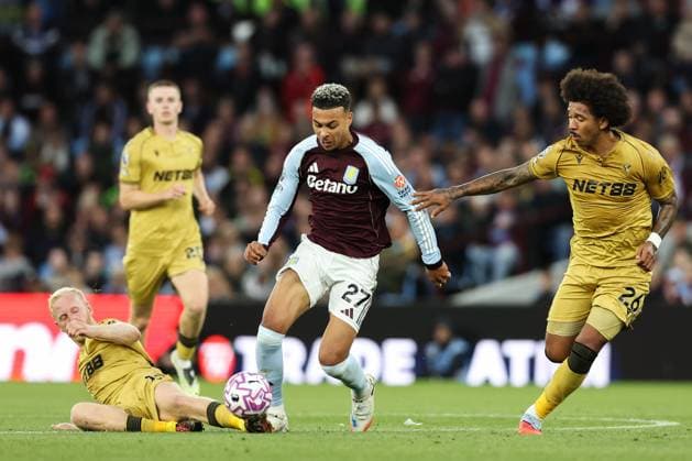 Birmingham, England, 31st August 2025. Will Hughes of Crystal Palace fouls Morgan Rogers of Aston Villa during the Aston Villa vs Crystal Palace Premier League match at Villa Park, Birmingham. Picture credit should read: Jessica Hornby Sportimage EDITORIAL USE ONLY. No use with unauthorised audio, video, data, fixture lists, club league logos or live services. Online in-match use limited to 120 images, no video emulation. No use in betting, games or single club league player publications. SPI_055_JH_Villa_Palace SPI-4102-0055