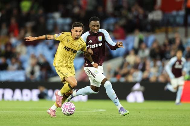 Birmingham, England, 31st August 2025. Yeremi Pino of Crystal Palace breaks with the ball whilst holding off Lamare Bogarde of Aston Villa during the Aston Villa vs Crystal Palace Premier League match at Villa Park, Birmingham. Picture credit should read: Jessica Hornby Sportimage EDITORIAL USE ONLY. No use with unauthorised audio, video, data, fixture lists, club league logos or live services. Online in-match use limited to 120 images, no video emulation. No use in betting, games or single club league player publications. SPI_080_JH_Villa_Palace SPI-4102-0080