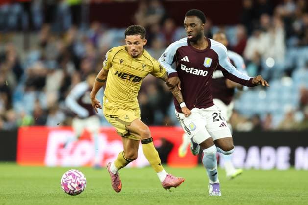 Birmingham, England, 31st August 2025. Yeremi Pino of Crystal Palace breaks with the ball whilst holding off Lamare Bogarde of Aston Villa during the Aston Villa vs Crystal Palace Premier League match at Villa Park, Birmingham. Picture credit should read: Jessica Hornby Sportimage EDITORIAL USE ONLY. No use with unauthorised audio, video, data, fixture lists, club league logos or live services. Online in-match use limited to 120 images, no video emulation. No use in betting, games or single club league player publications. SPI_081_JH_Villa_Palace SPI-4102-0081