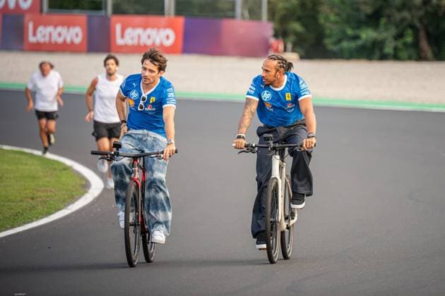 September 4, 2025, Monza, Italy: Scuderia Ferrari HP drivers (L-R) CHARLES LECLERC and LEWIS HAMILTON do some laps on a bicycle at Autodromo di Monza, during preparations for the Formula One Italian Grand Prix. F1 2025: Italian Grand Prix.: Preparations  - ZUMA 20250904_mda_p257_029 Copyright: xCristopherxPonsox