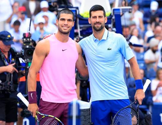 Novak Djokovic of Serbia (R) and Carlos Alcaraz of Spain pose for a photo before their Men s semifinal match at the 2025 US Open Tennis Championship at the USTA Billie Jean King National Tennis Center in New York City on Friday, September 5, 2025.  NYP20250905901 JOHNxANGELILLO
