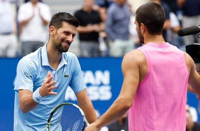 Novak Djokovic of Serbia congratulates Carlos Alcaraz of Spain after Alcaraz won their Men s semifinal match at the 2025 US Open Tennis Championship at the USTA Billie Jean King National Tennis Center in New York City on Friday, September 5, 2025. Alcaraz won 6-4, 7-6, 6-2 and advances to the finals on Sunday.  NYP20250905926 JOHNxANGELILLO