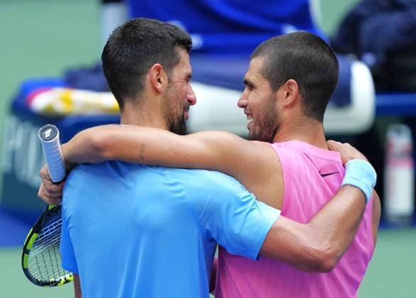 (250906) -- NEW YORK, Sept. 6, 2025 -- Carlos Alcaraz (R) greets Novak Djokovic of Serbia after the men s singles semifinal match between Novak Djokovic of Serbia and Carlos Alcaraz of Spain at the 2025 US Open tennis championships in New York, the United States, Sept. 5, 2025. ) (SP)U.S.-NEW YORK-TENNIS-US OPEN-MEN S SINGLES-SEMIFINALS WuxXiaoling 