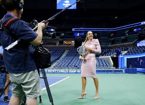 Aryna Sabalenka of Belarus gets spruced up,and brings her US Open Championship Trophy into Arthur Ashe Stadium for photos after defeating Amanda Anisimova at the Women s Finals of the 2025 US Open Tennis Championship in Arthur Ashe Stadium at the USTA Billie Jean King National Tennis Center in Flushing Meadows, New York on Saturday, September 6, 2025. Sabalenka defeated Anisimova 6-3, 7-6 to win her second consecutive US Open Championship.  NYP20250906223 JOHNxANGELILLO