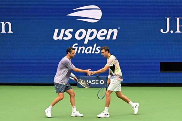 (250907) -- NEW YORK, Sept. 7, 2025 -- Marcel Granollers (R) Horacio Zeballos celebrate scoring during the men s doubles final match between Marcel Granollers of Spain Horacio Zeballos of Argentina and Joe Salisbury Neal Skupski of Britain at the 2025 US Open tennis championships in New York, the United States, Sept. 6, 2025. ) (SP)U.S.-NEW YORK-TENNIS-US OPEN-MEN S DOUBLES-FINAL LixRui 