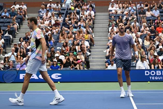 (250907) -- NEW YORK, Sept. 7, 2025 -- Marcel Granollers (L) Horacio Zeballos react during the men s doubles final match between Marcel Granollers of Spain Horacio Zeballos of Argentina and Joe Salisbury Neal Skupski of Britain at the 2025 US Open tennis championships in New York, the United States, Sept. 6, 2025. ) (SP)U.S.-NEW YORK-TENNIS-US OPEN-MEN S DOUBLES-FINAL LixRui 