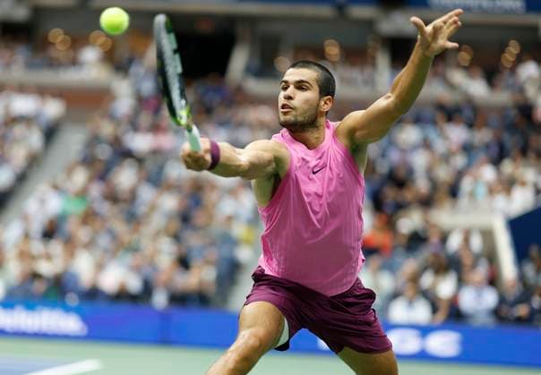 Carlos Alcaraz of Spain hits a return to Jannik Sinner of Italy in the first set in the Men s Finals of the 2025 US Open Tennis Championship in Arthur Ashe Stadium at the USTA Billie Jean King National Tennis Center in Flushing Meadows, New York, on Sunday, September 7, 2025.  NYP20250907139 COREYxSIPKIN