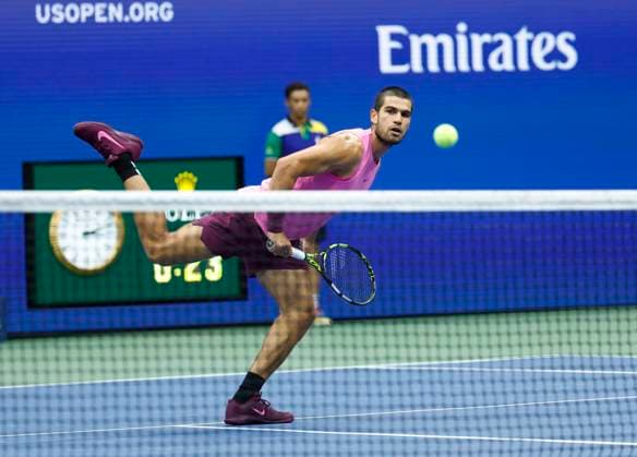 Carlos Alcaraz of Spain hits a drop shot winner to Jannik Sinner of Italy in the first set in the Men s Finals of the 2025 US Open Tennis Championship in Arthur Ashe Stadium at the USTA Billie Jean King National Tennis Center in Flushing Meadows, New York, on Sunday, September 7, 2025.  NYP20250907141 COREYxSIPKIN