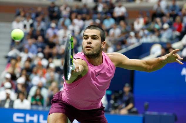 Carlos Alcaraz of Spain hits a return to Jannik Sinner of Italy in the second set in the Men s Finals of the 2025 US Open Tennis Championship in Arthur Ashe Stadium at the USTA Billie Jean King National Tennis Center in Flushing Meadows, New York, on Sunday, September 7, 2025.  NYP20250907146 COREYxSIPKIN