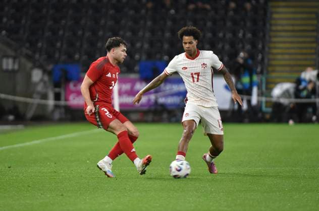 9th September 2025; Swansea.com Stadium, Swansea, Wales; Friendly International Football, Wales versus Canada; Neco Williams of Wales tackles Tajon Buchanan of Canada  AledxHopkins