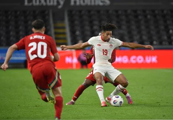 9th September 2025; Swansea.com Stadium, Swansea, Wales; Friendly International Football, Wales versus Canada; Nathan-Dylan Saliba of Canada being pressured by Ronan Kpakio and Daniel James of Wales  AledxHopkins