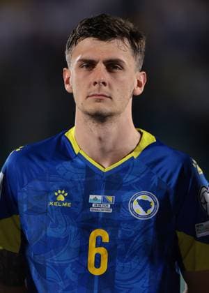 Serravalle, Italy, 6th September 2025. Benjamin Tahirovic of Bosnia and Herzegovina looks on during the line up prior to the San Marino vs Bosnia-Herzegovina FIFA World Cup, WM, Weltmeisterschaft, Fussball Qualifier match at San Marino Stadium, Serravalle. Picture credit should read: Jonathan Moscrop Sportimage EDITORIAL USE ONLY. No use with unauthorised audio, video, data, fixture lists, club league logos or live services. Online in-match use limited to 120 images, no video emulation. No use in betting, games or single club league player publications. SPI_088_JM_SANMARINO_BOSNIA_ SPI-4110-0087
