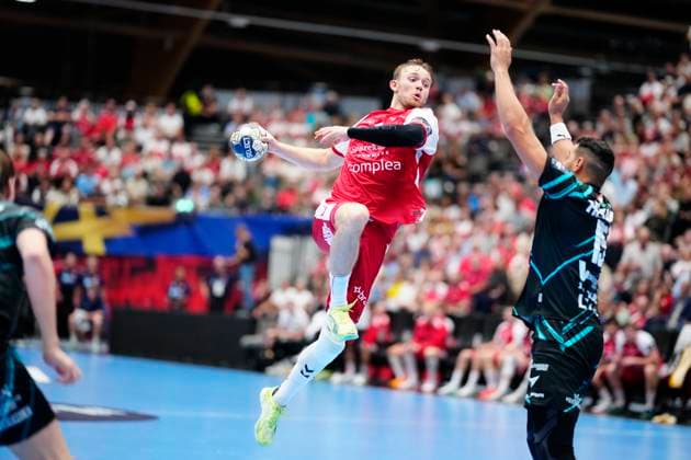 Denmark EHF Champions League Aalborgs Thomas Arnoldsen and Veszprem s Ahmed Hesham during EHF Champions League men s handball match between Aalborg Handball and One Veszprém HC at Sparekassen Danmark Arena in Aalborg on Wednesday, September 10, 2025. (Photo: Henning Bagger Scanpix 2025) , Aalborg Denmark Copyright: HenningxBaggerx spdk20250910-194045-L
