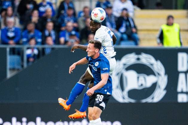 12.09.2025 - Fußball, 2025 2026, 2. Bundesliga, 5. Spieltag, DSC Arminia Bielefeld - 1. FC Magdeburg: (L-R) Marius Wörl (Bielefeld), Daniel Heber (Magdeburg) DFL REGULATIONS PROHIBIT ANY USE OF PHOTOGRAPHS AS IMAGE SEQUENCES AND OR QUASI-VIDEO.