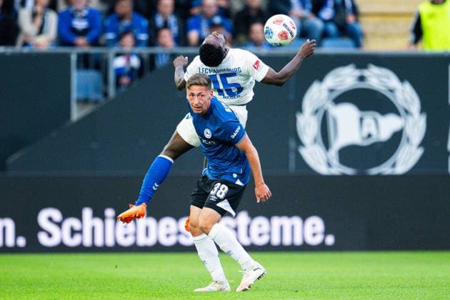 12.09.2025 - Fußball, 2025 2026, 2. Bundesliga, 5. Spieltag, DSC Arminia Bielefeld - 1. FC Magdeburg: (L-R) Marius Wörl (Bielefeld), Daniel Heber (Magdeburg) DFL REGULATIONS PROHIBIT ANY USE OF PHOTOGRAPHS AS IMAGE SEQUENCES AND OR QUASI-VIDEO.