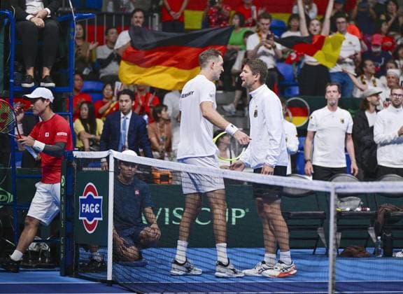 Tennis: Davis Cup Jan-Lennard Struff (C) of Germany is pictured after defeating Yoshihito Nishioka (L) of Japan in the second round of the Davis Cup team tennis qualifiers at Ariake Colosseum in Tokyo on Set. 12, 2025.  A14AA0004844720P