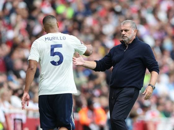 London, England, 13th September 2025. Ange Postecoglou manager of Nottingham Forest greets injured Murillo of Nottingham Forest during the Arsenal vs Nottingham Forest Premier League match at the Emirates Stadium, London. Picture credit should read: David Klein Sportimage EDITORIAL USE ONLY. No use with unauthorised audio, video, data, fixture lists, club league logos or live services. Online in-match use limited to 120 images, no video emulation. No use in betting, games or single club league player publications. SPI_048_DK_Arsenal_Forest SPI-4131-0046