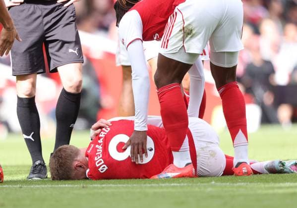 Martin Odegaard (A) goes down injured at the Arsenal v Nottingham Forest EPL match, at the Emirates Stadium, London, UK on 13th September, 2025. 