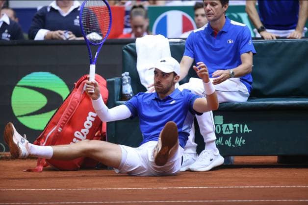 Croatia v France - 2025 Davis Cup Qualifiers Second Round: Day 2 OSIJEK, CROATIA - SEPTEMBER 13: Benjamin Bonzi of France falls during the 2025 Davis Cup Qualifier second round match against Mate Pavic and Nikola Mektic of Croatia at Dvorana Gradski Vrt on September 13, 2025 in Osijek, Croatia.  DavidxJerkovic PIXSELL