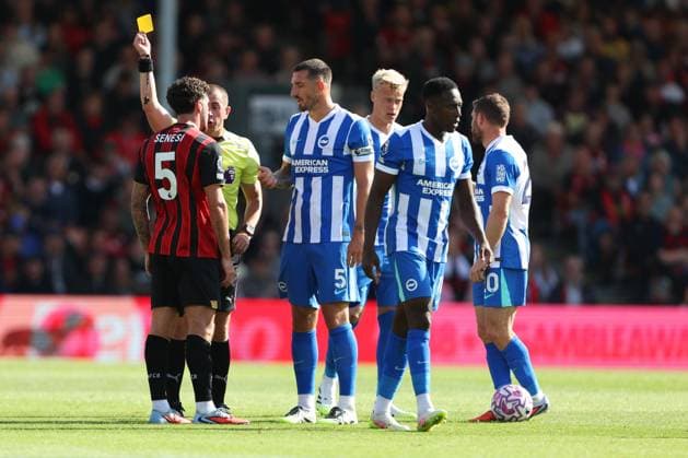 Football - 2025 2026 Premier League - AFC Bournemouth vs Brighton & Hove Albion - Vitality Stadium - Saturday 13th September 2025 Marcos Senesi of Bournemouth receives a yellow card from Referee Mr Peter Banks during the Premier League match at the Vitality Stadium COLORSPORT Shaun Boggust 