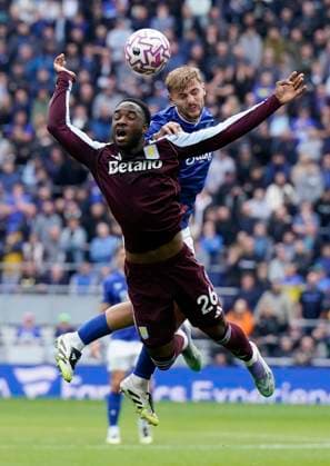 Liverpool, England, 13th September 2025. Lamare Bogarde of Aston Villa (L) is challenged by Kiernan Dewsbury-Hall of Everton during the Everton vs Aston Villa Premier League match at Hill Dickinson Stadium, Liverpool. Picture credit should read: Andrew Yates Sportimage EDITORIAL USE ONLY. No use with unauthorised audio, video, data, fixture lists, club league logos or live services. Online in-match use limited to 120 images, no video emulation. No use in betting, games or single club league player publications. SPI_011_AY_EVERTON_VILLA SPI-4134-0010