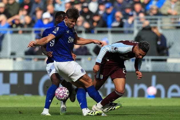 13th September 2025; Hill Dickinson Stadium, Liverpool, England; Premier League Football, Everton versus Aston Villa; James Tarkowski of Everton tackles Morgan Rogers of Aston Villa  DavidxBlunsden