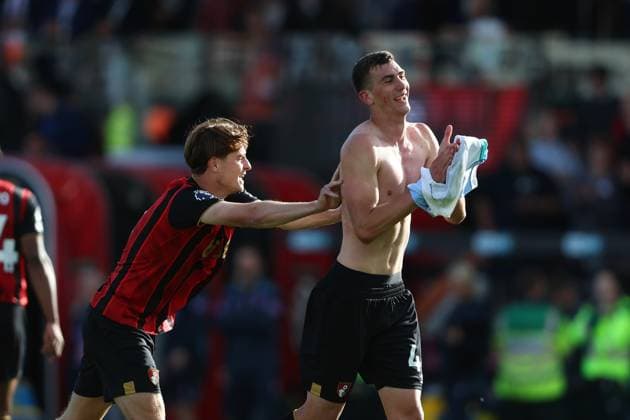 Football - 2025 2026 Premier League - AFC Bournemouth vs Brighton & Hove Albion - Vitality Stadium - Saturday 13th September 2025 Alex Scott pushes player of the match Veljko Milosavljevic of Bournemouth towards the fans to celebrate after the final whistle at the Vitality Stadium COLORSPORT Shaun Boggust 