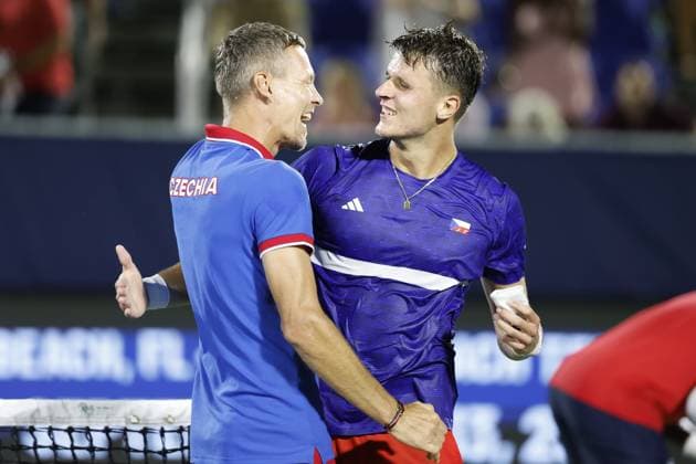 Czech non-playing captain Tomas Berdych, left, and Jakub Mensik of Czech Republic celebrate after winning the USA vs Czech Republic qualifying match to advance to the final group of the Davis Cup 2025 at the Delray Beach Tennis Center in Delray Beach, USA, September 14, 2025. (CTKxPhoto PavelxLebeda) CTKPhotoF202509140000301  CTKPhotoF202509140000301