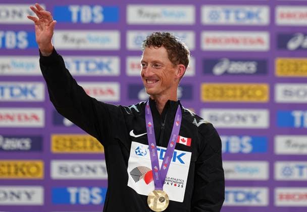 (250914) -- TOKYO, Sept. 14, 2025 -- Gold medalist Evan Dunfee of Canada reacts during the awarding ceremony of men s 35km race walk at the 2025 World Athletics Championships in Tokyo, Japan, Sept. 14, 2025. ) (SP)JAPAN-TOKYO-ATHLETICS-WORLD ATHLETICS CHAMPIONSHIPS-MEN S 35KM RACE WALK JuxHuanzong 