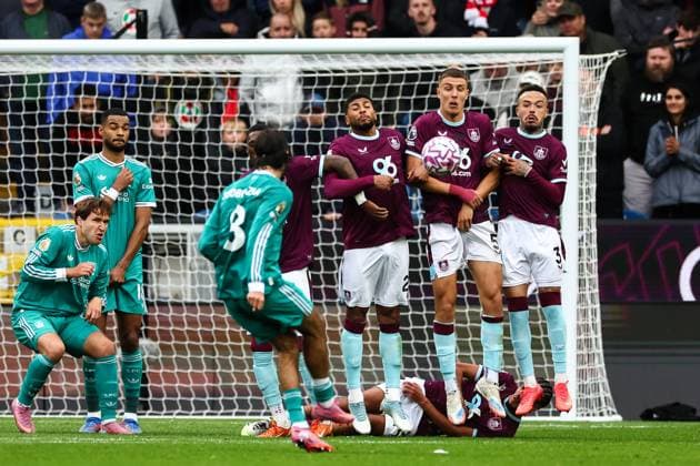 Burnley, England, 14th September 2025. Maxime Esteve of Burnley blocks a free kick from Dominik Szoboszlai of Liverpool during the Burnley vs Liverpool Premier League match at Turf Moor, Burnley. Picture credit should read: Simon Bellis Sportimage EDITORIAL USE ONLY. No use with unauthorised audio, video, data, fixture lists, club league logos or live services. Online in-match use limited to 120 images, no video emulation. No use in betting, games or single club league player publications. SPI_039_SB_BURNLEY_LIVERPOOL SPI-4138-0039