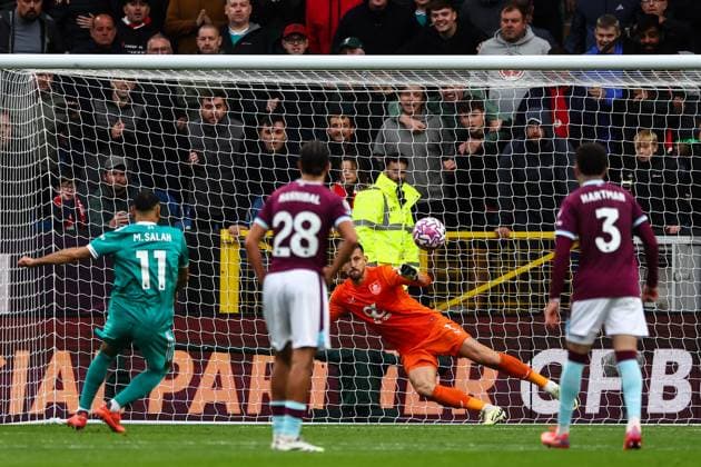 Burnley, England, 14th September 2025. Mohamed Salah of Liverpool scores a penalty to make it 0-1 during the Burnley vs Liverpool Premier League match at Turf Moor, Burnley. Picture credit should read: Simon Bellis Sportimage EDITORIAL USE ONLY. No use with unauthorised audio, video, data, fixture lists, club league logos or live services. Online in-match use limited to 120 images, no video emulation. No use in betting, games or single club league player publications. SPI_042_SB_BURNLEY_LIVERPOOL SPI-4138-0042