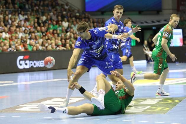 14.09.2025, xtgx, SC Magdeburg - TVB Stuttgart v.l. Omar Ingi Magnusson (Magdeburg, 14), Kai Haefner (Häfner, Stuttgart, 34) Zweikampf, Duell, Kampf, tackle Magdeburg